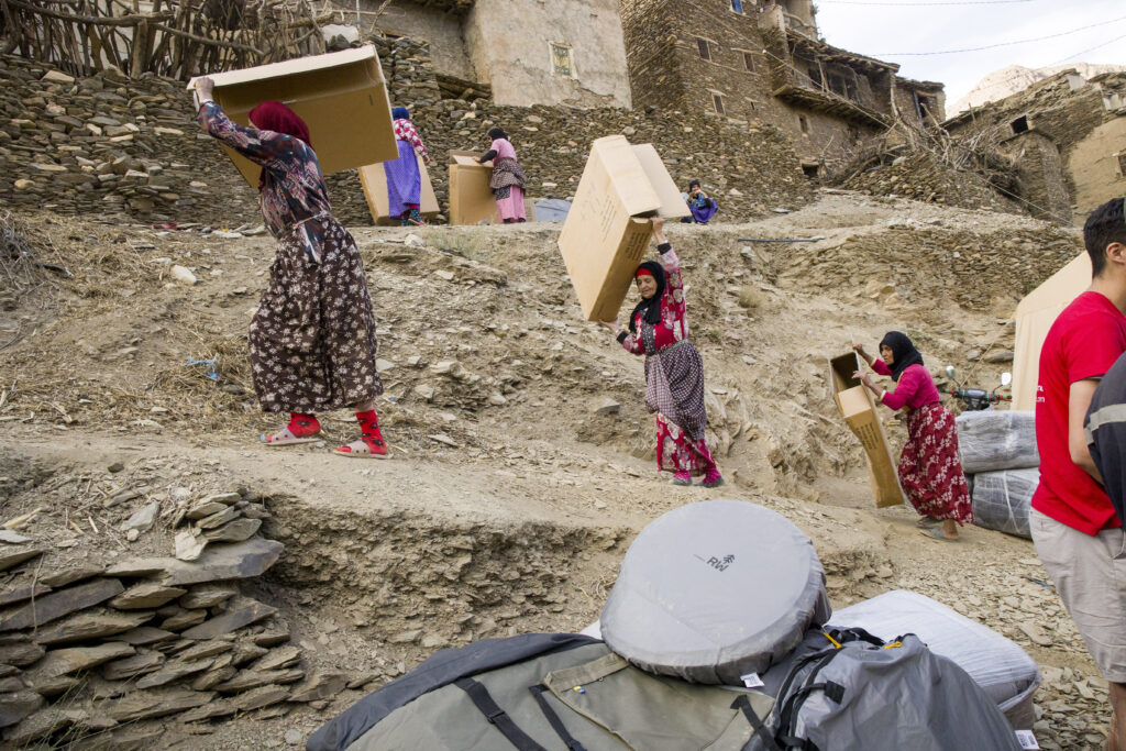 Women receiving aid during People for People's 2023 mission to Morocco  