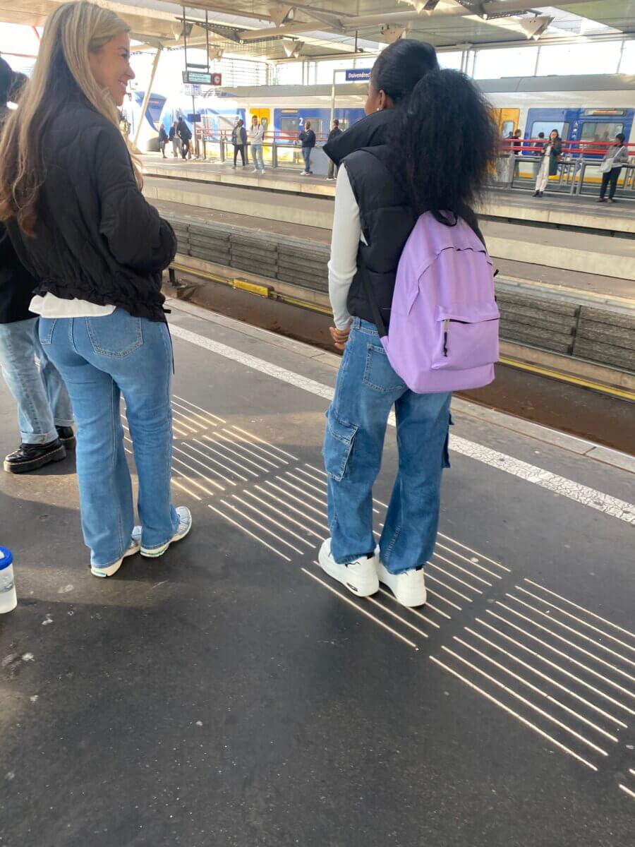 Girl wears a schoolbag provided by People for People