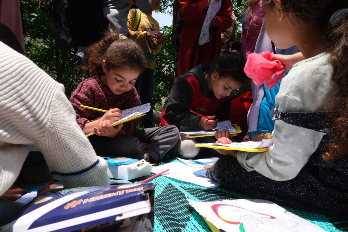 Children paint at a workshop organised by People for People in Al Haouz, Morocco