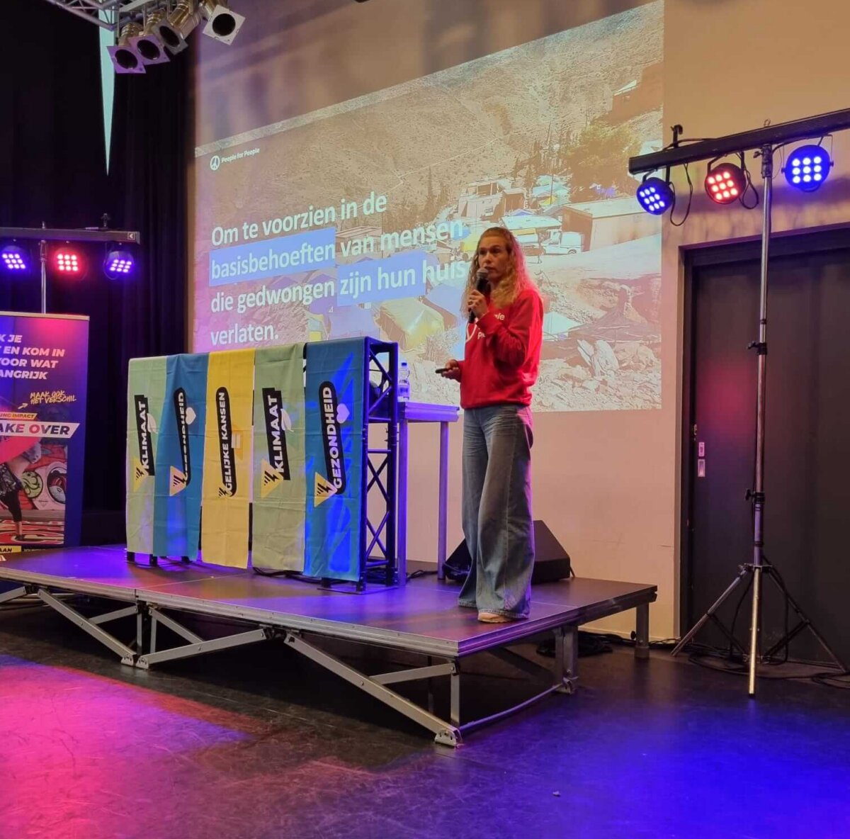 Pauline from People for People speaks to school students during a Young Impact event